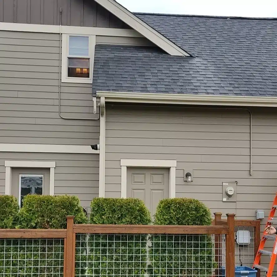 Side of two-story home showcasing electrical work